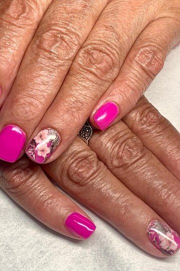 Hot pink nails with floral art for older women