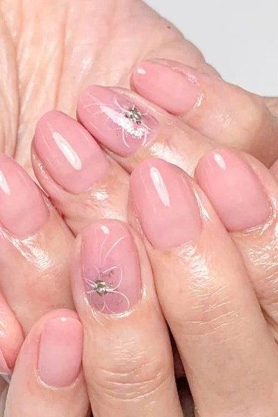 Pink Nails with Starburst Nail Art - short nail design idea for women over 50