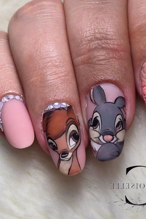 Pink almond nails with Thumper and Bambi portraits and pearl stud accents
