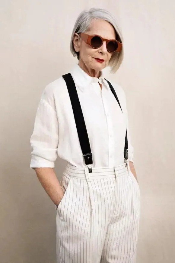 White shirt with suspenders and striped trousers for older women