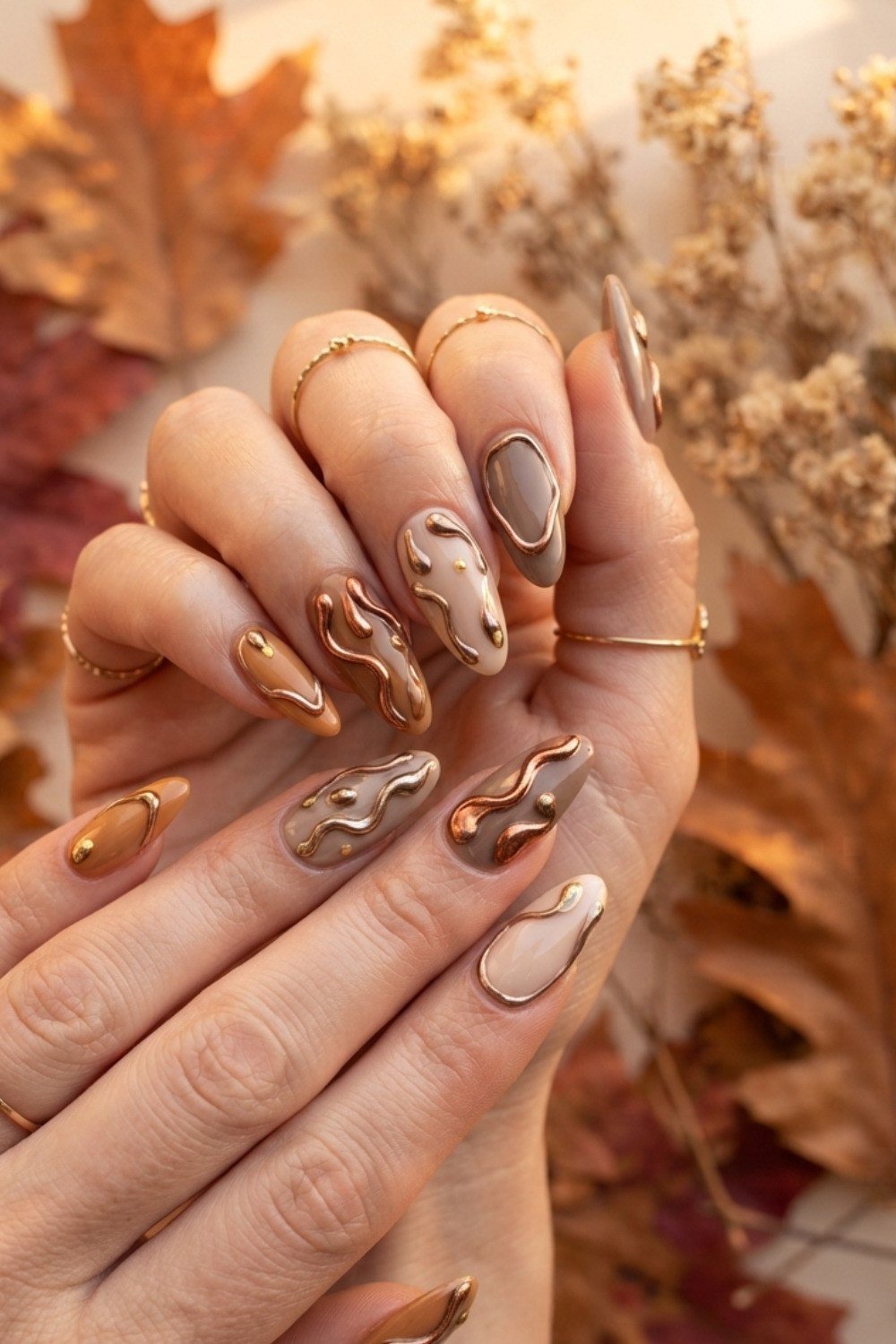 Copper marble almond with fall leaves background, elegant fall nail design for women over 40