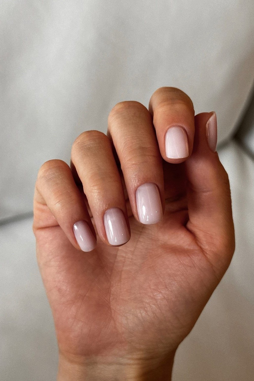 Sheer Nude Squoval - short nail design for women over 60 that makes nails look longer