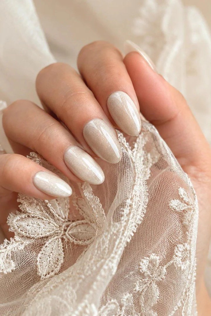 Sheer White Pearl Oval Nails - pearl finish nail idea for women over 60