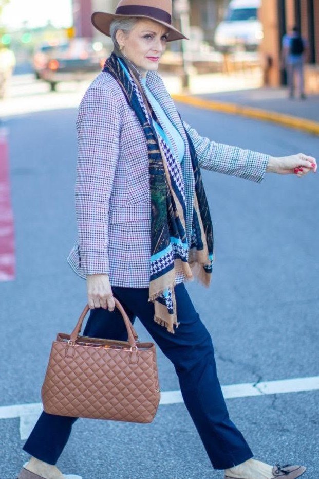 Elegant fall outfit for women over 70: lilac blazer with printed scarf and hat
