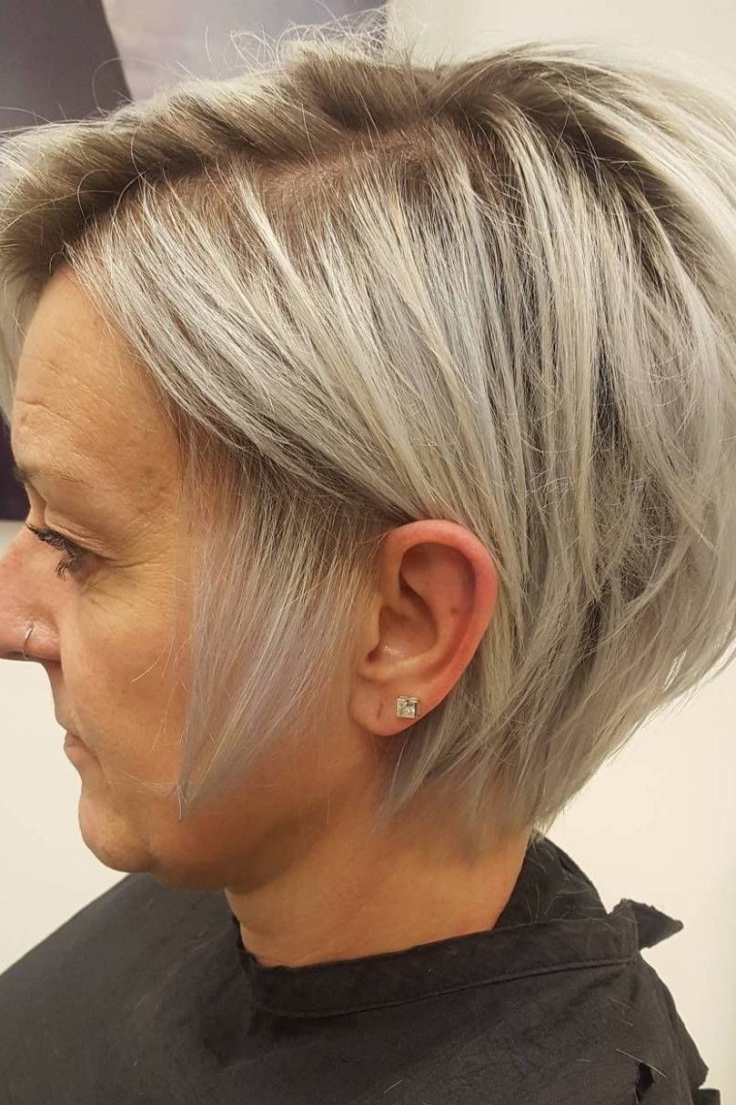 Angled blonde bob haircut for women over 50