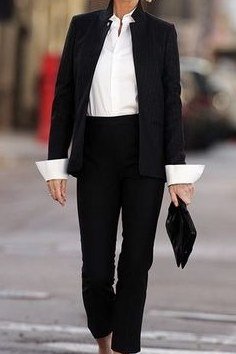 Black suit white shirt, silver-haired woman walking on street - business casual work outfit for women over 50
