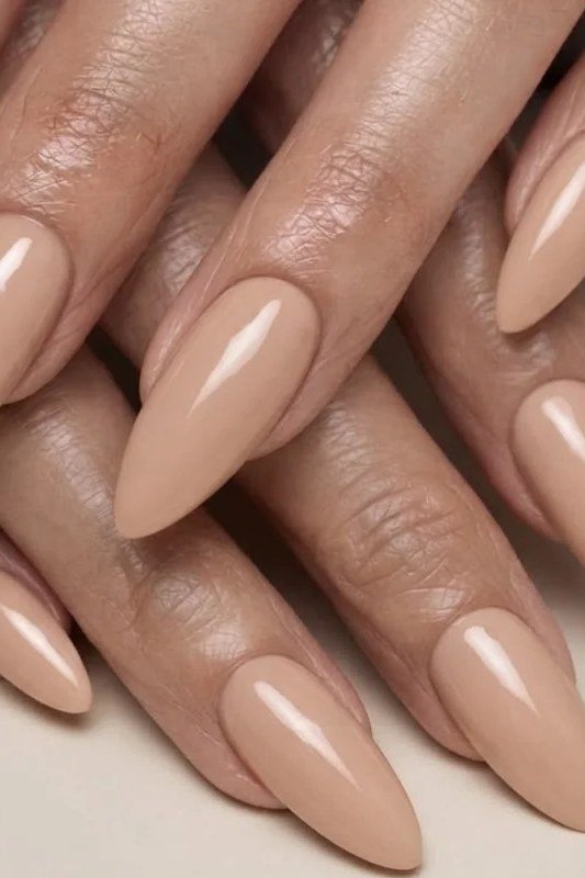 Best nails for women over 50: long nude almond