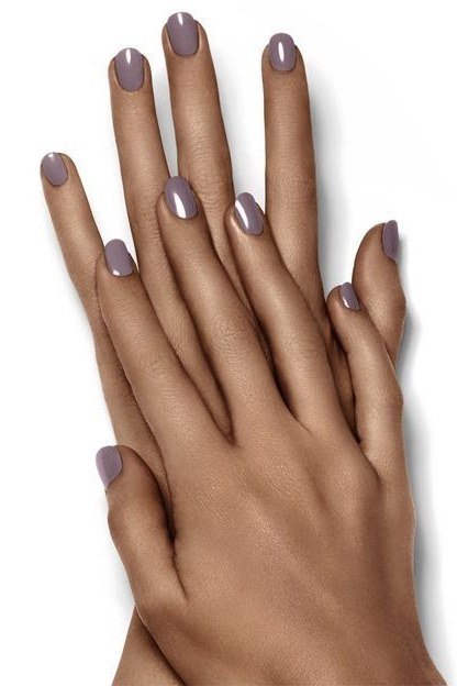 Mauve short nails on dark skin hand, best manicure idea for women over 60