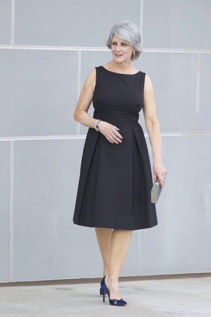 Black sleeveless A-line midi dress for women over 50