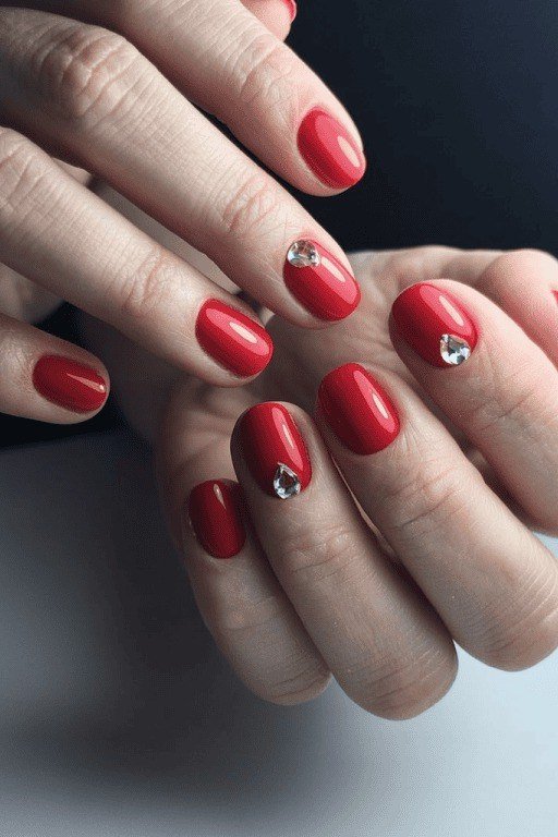 Red rhinestone accent mature hands nails for women over 50