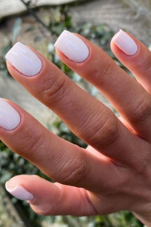 Milky White Oval - short nail design for women over 60 that makes nails look longer
