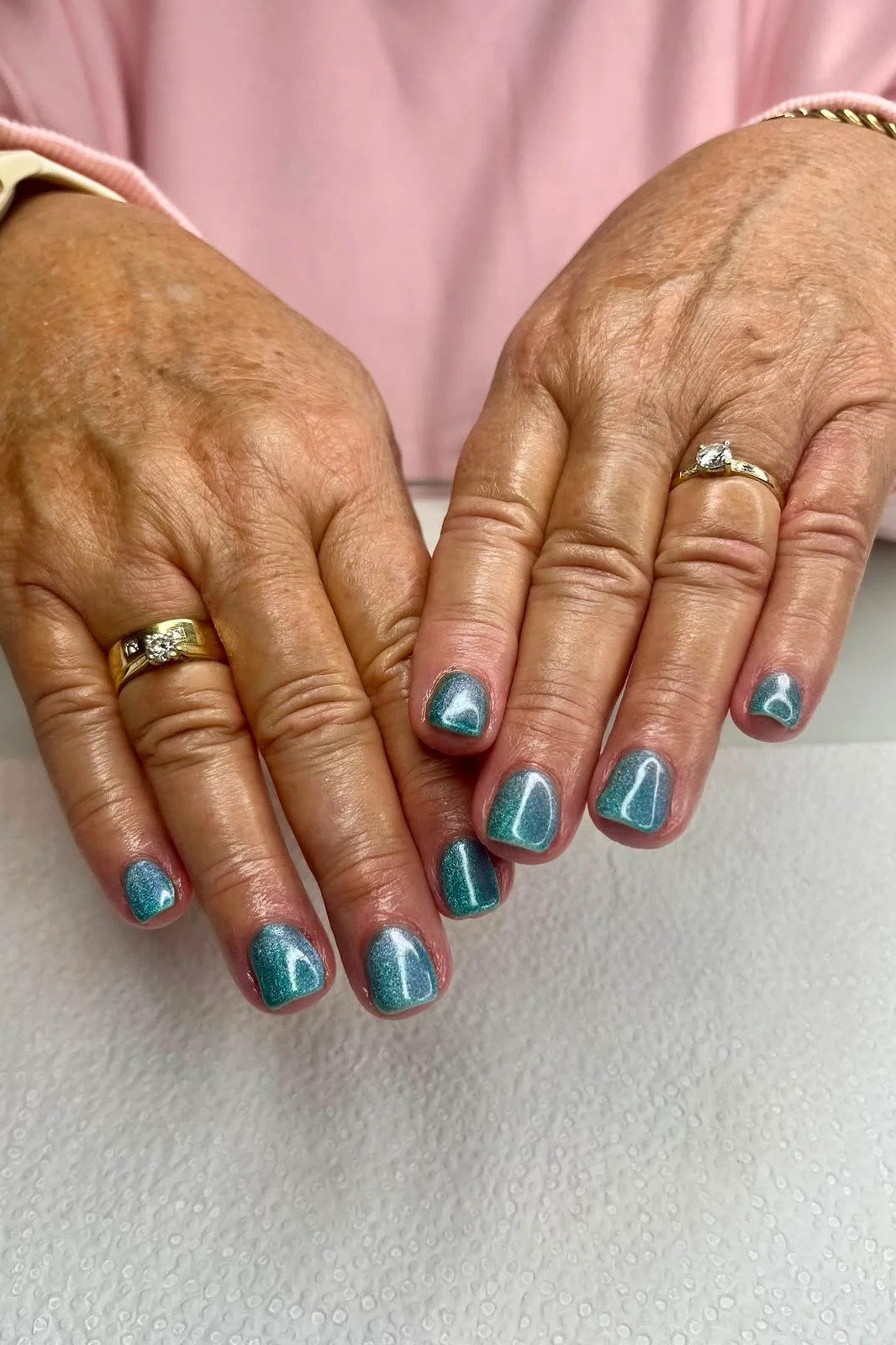 Ocean Teal Cat Eye Nails - Bright ocean teal with fine shimmer glows on these short, rounded nails.