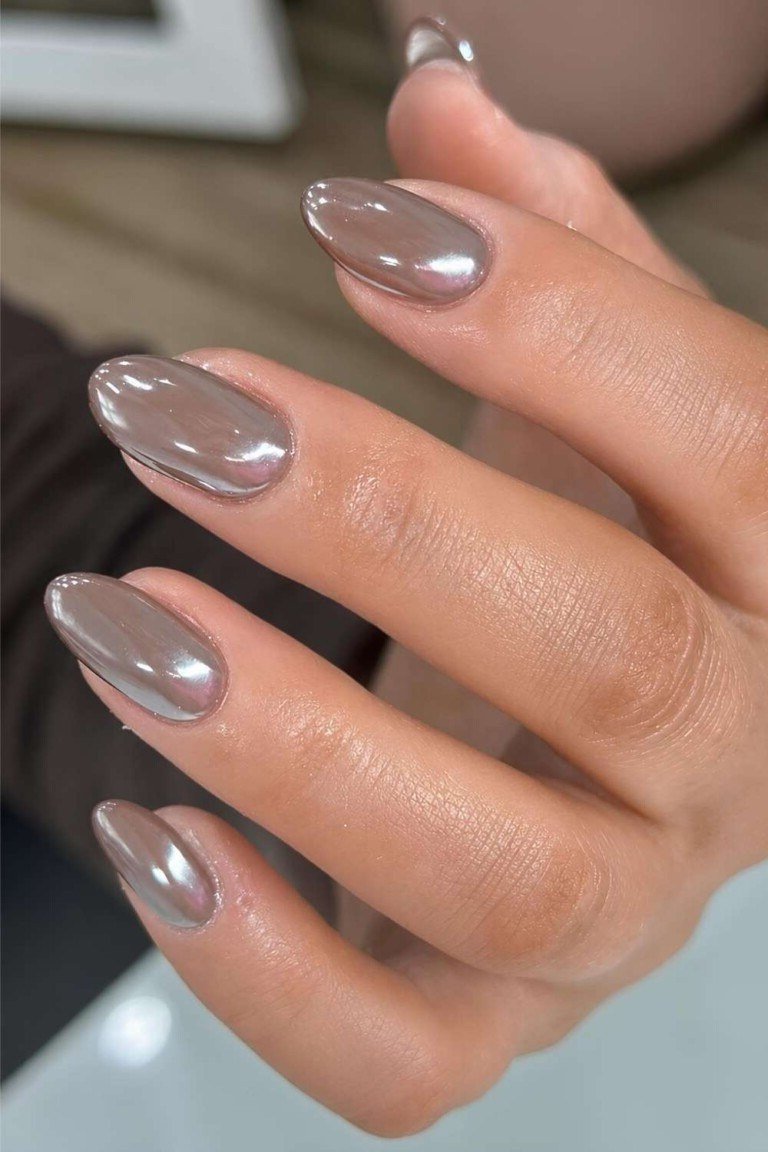taupe glossy chrome almond nails