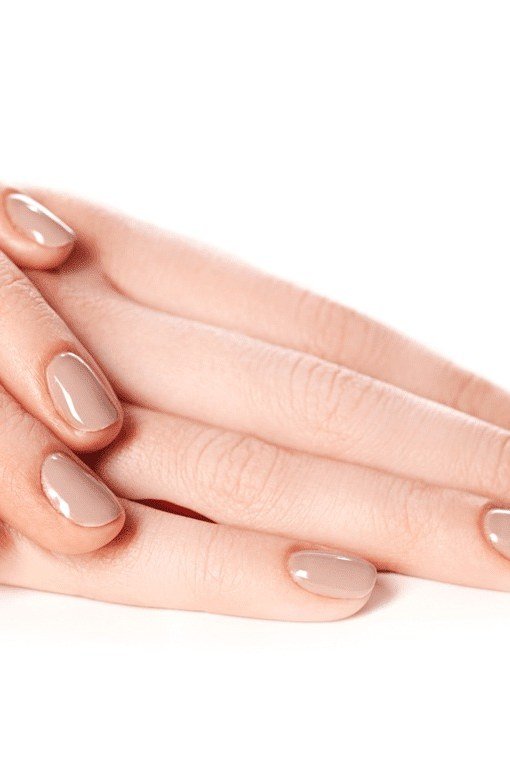 Soft pink nude nails with crossed elegant hands