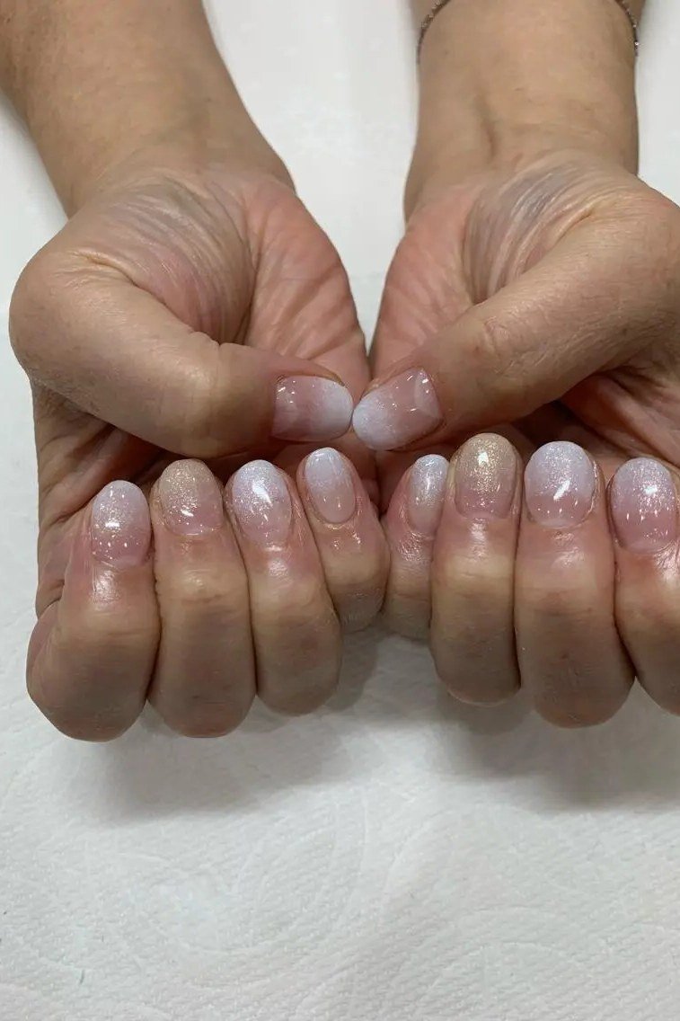 Sheer nude ombre on mature hands, short natural nails, ombre nail design for women over 60