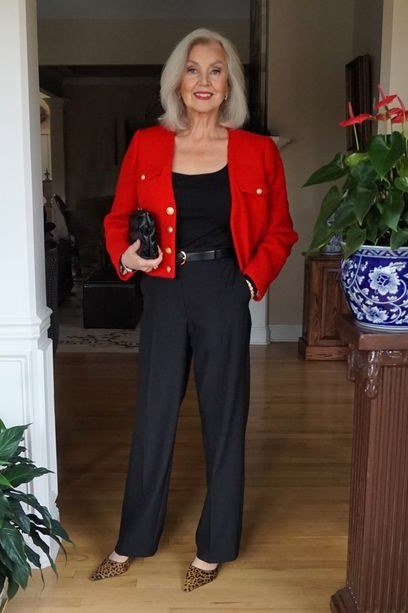 Red jacket with black top and black wide-leg trousers for women over 50