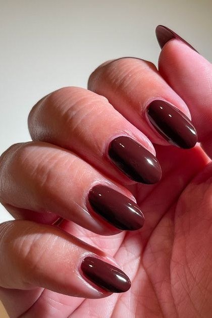 Deep Red-Brown Glossy Short Almond Nails - brown nail idea for women over 50