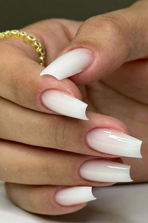 Milky white medium length almond shaped nails