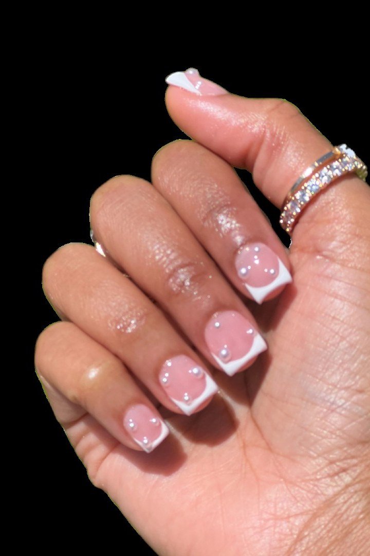 Nail art design for women over 60: pink french tips on black background