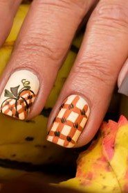 9. Taupe Nails With Plaid and Tiny Pumpkins - Thanksgiving nail art idea for women over 50