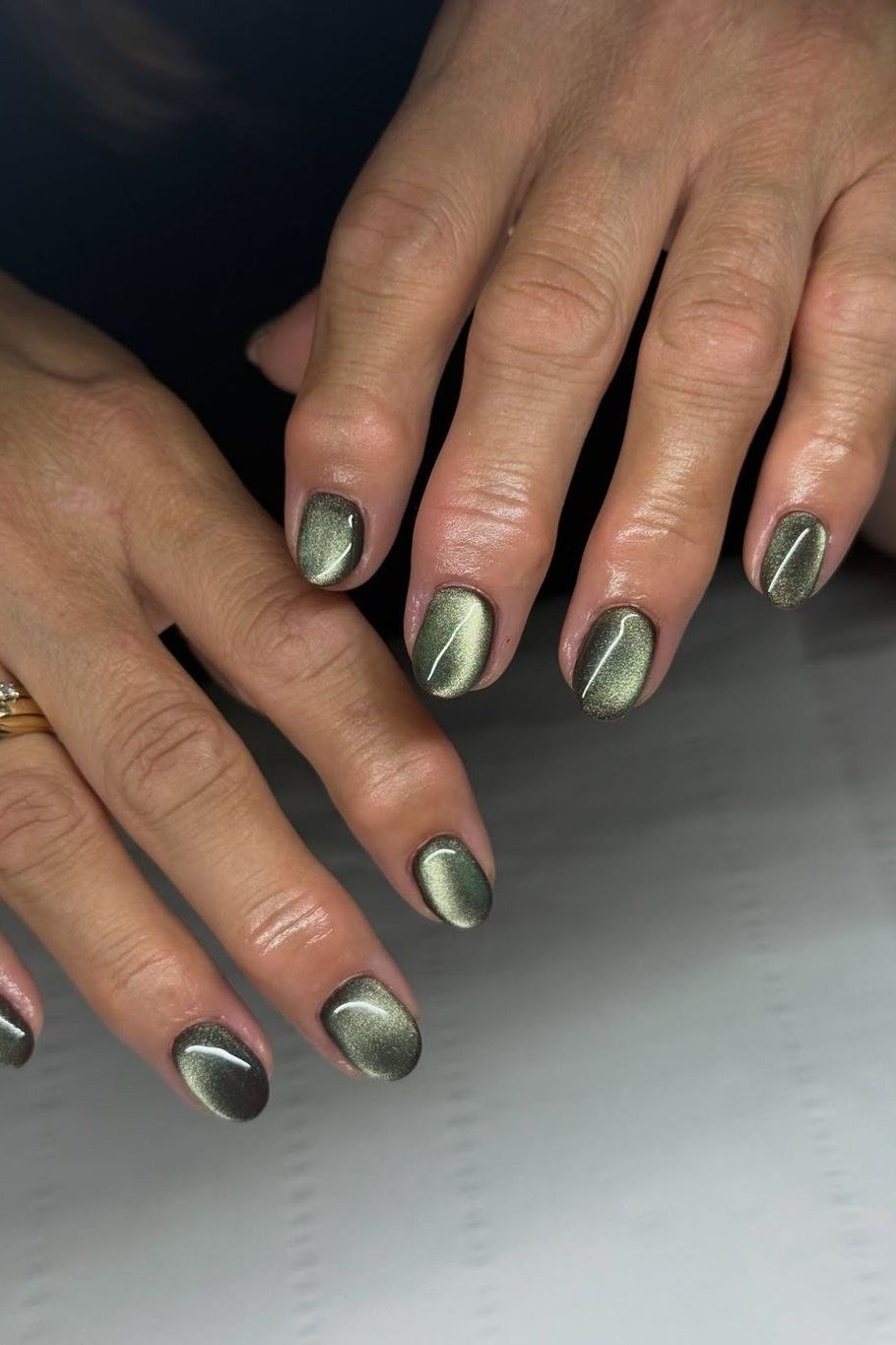 Sage Green Cat Eye Nails - Soft sage green with gentle magnetic shimmer covers these short, oval nails.