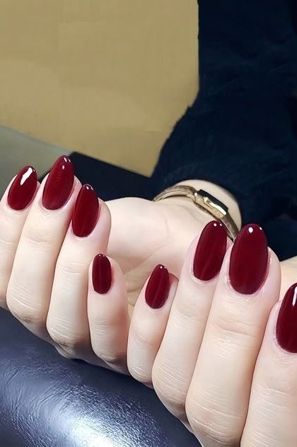 Oxblood nails in short almond shape
