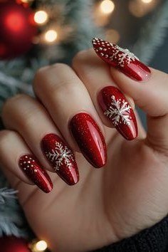 red chrome christmas nails with delicate white snowflakes