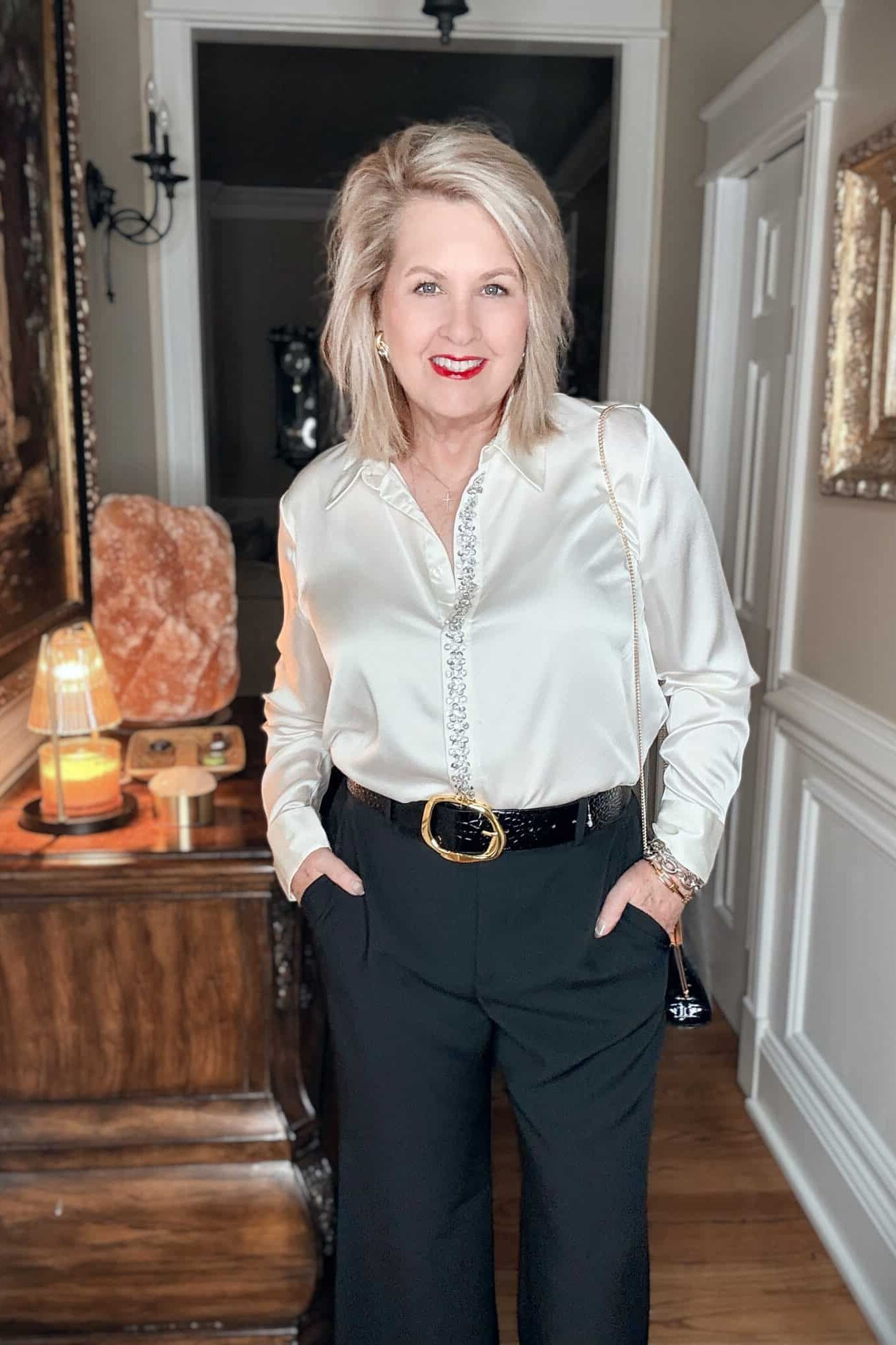 white satin blouse with black wide-leg trousers church outfit for women over 60