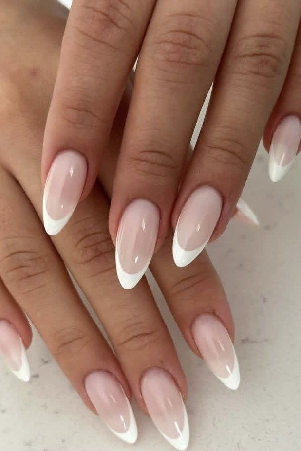 white pink baby boomer fade on long almond nails