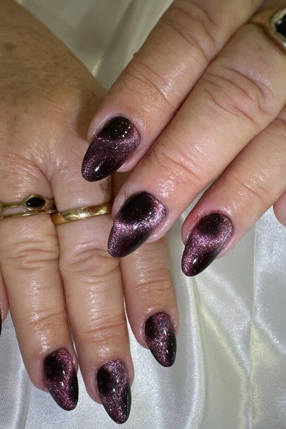 Velvet Plum Cat Eye Nails - Deep plum with velvety magnetic shimmer covers these medium length almond nails.