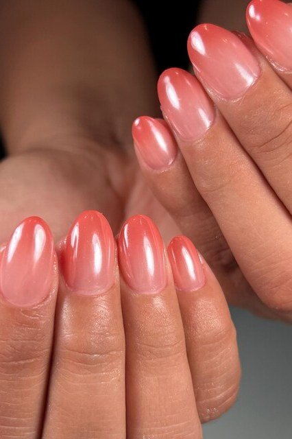 Pearl Chrome Peach Pink Almond Nails - A soft peach pink ombre gets a dreamy pearl chrome finish on these medium almond nails.
