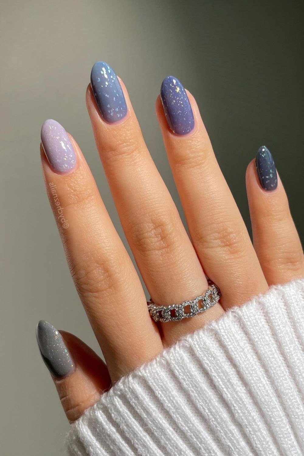 blue-grey gradient, almond, white sweater