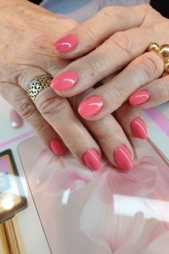 Coral Red Gel Nails - short gel nail idea for women over 50