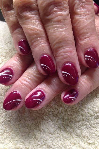 Burgundy Nails with White Swirl Art nail design for women over 40
