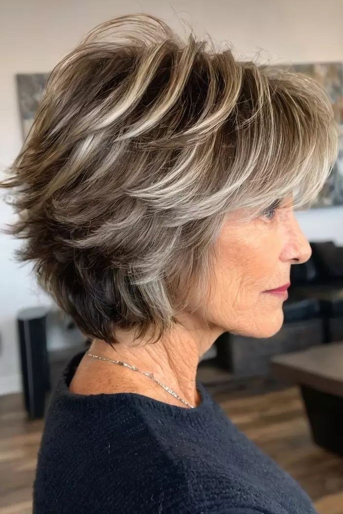 Grey layered bob side view, dark top, short layered bob hairstyle for women over 60