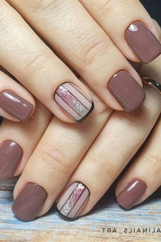 Mauve gel nails with striped art for mature hands