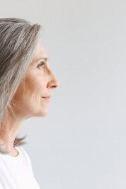 shoulder length grey hair with soft layers, side view