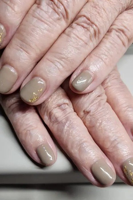 Taupe nude medium oval sophisticated - flattering nail design for older women