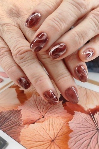 Chocolate and Burgundy Marble - fall nail color idea for women over 60