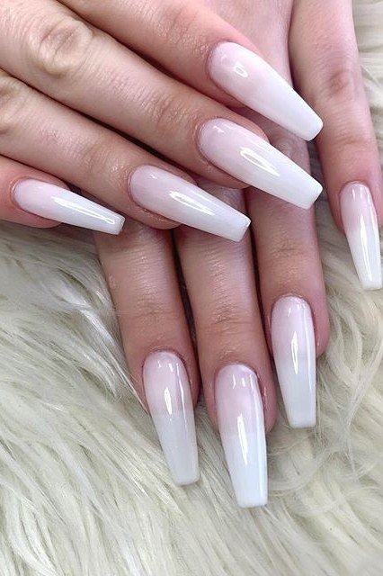 Very long milky white nails styled on white fur