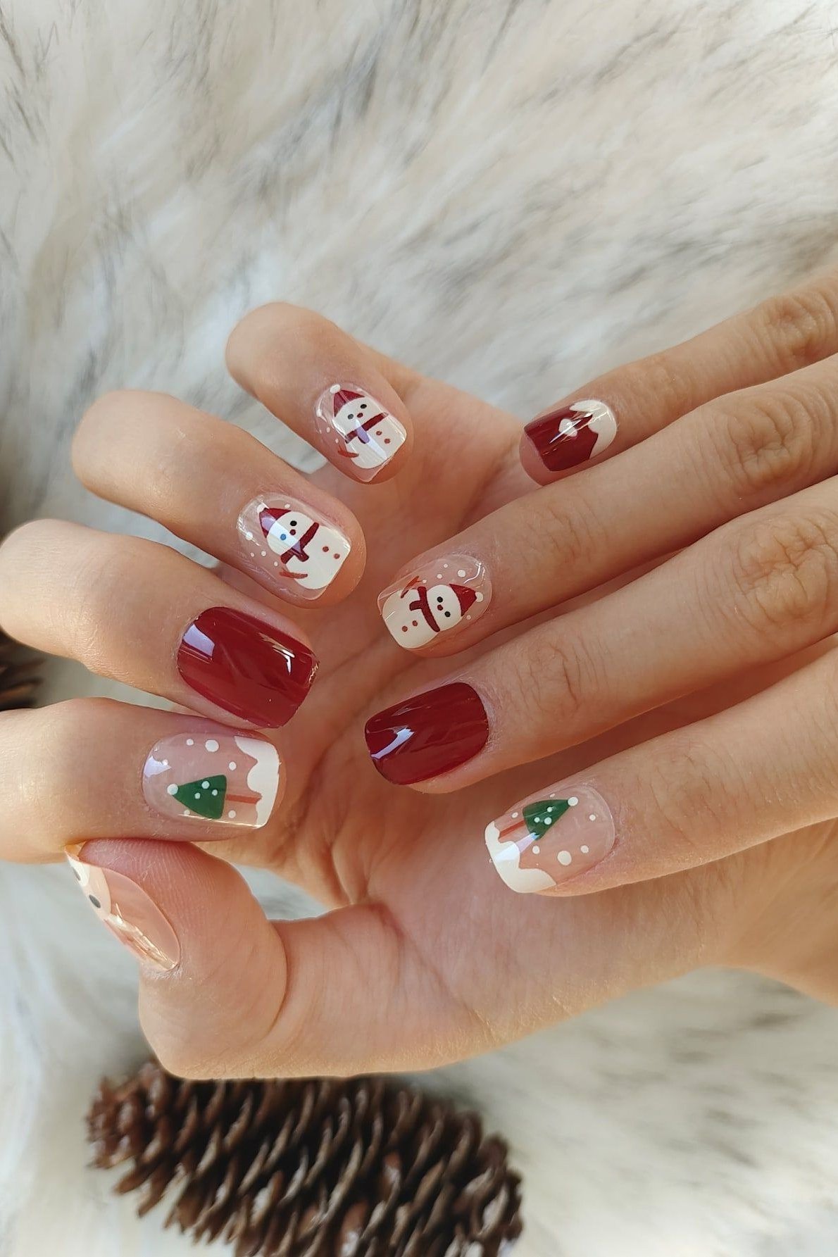 Burgundy and White Nails with Reindeer and Trees, fun winter nail idea for women over 60