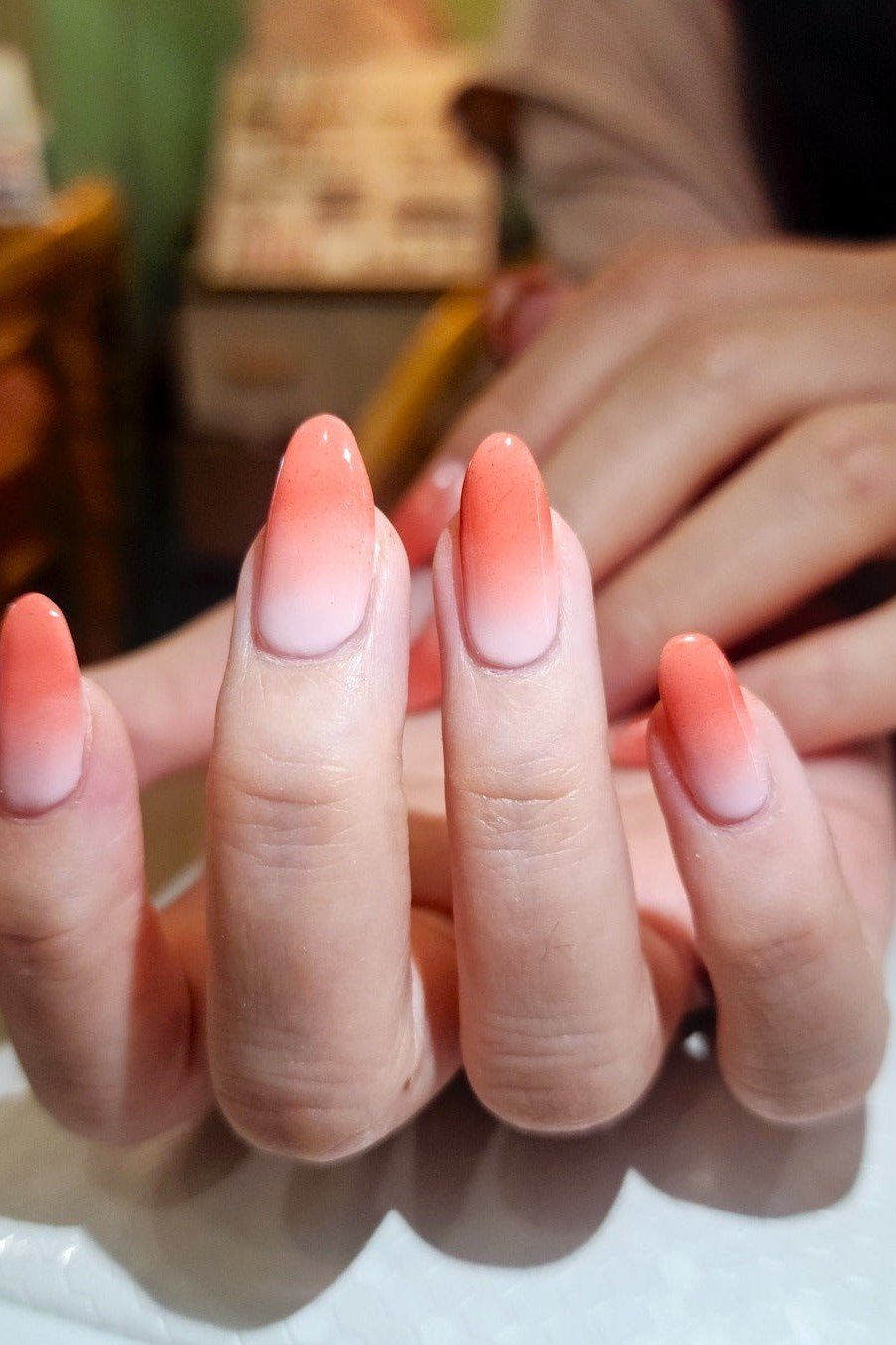 Soft Peach Nude Almond Ombre - Sheer peach fades into a soft nude on these medium almond nails.