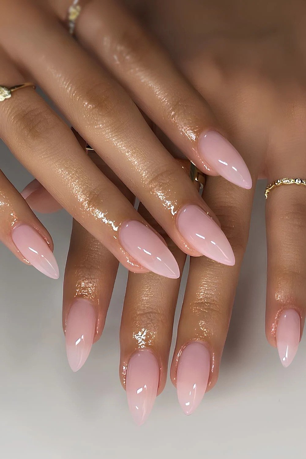 Glossy pink almond manicure