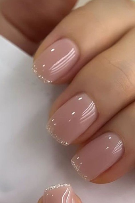 Sheer nude pink gel nails for mature hands