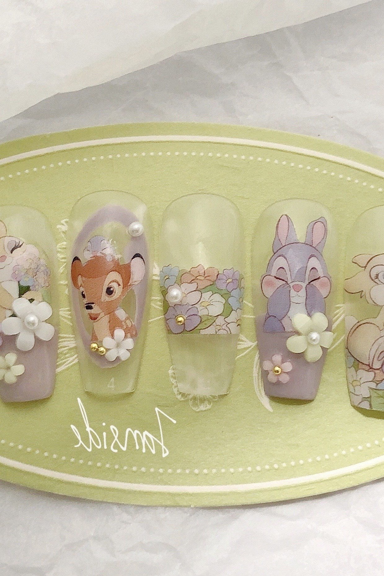 Pastel press-on nail set with Bambi and flower art on mint and lavender bases