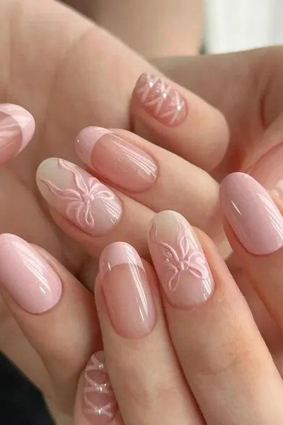 Blush nails with embossed white flower nail art