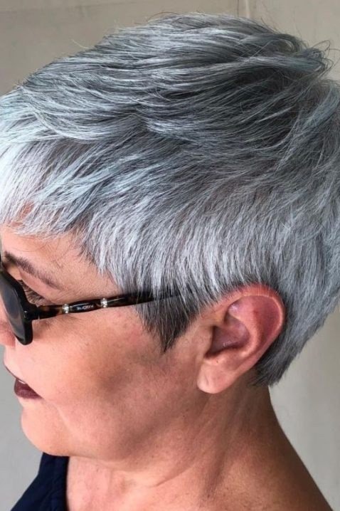 Salt and pepper textured pixie, neat tapered cut, side view with glasses for women over 60