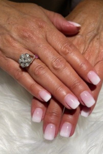 Pink to white ombre on mature hands, medium almond nails, ombre nail design for women over 60