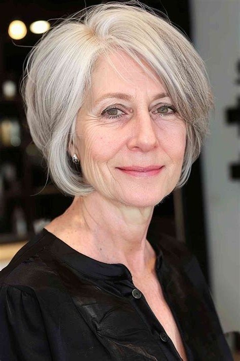 medium silver bob with side part, front view, medium length hairstyle for women over 60
