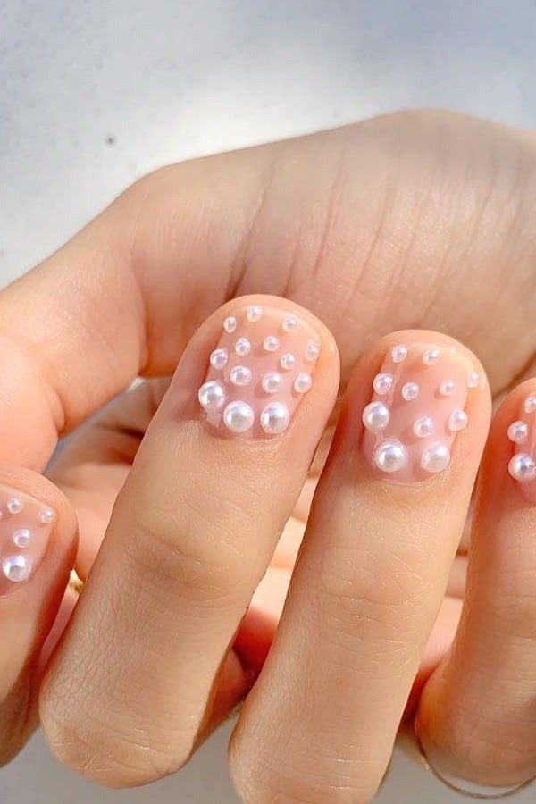 Nail art design for women over 60: pearl dot nail art on nude nails